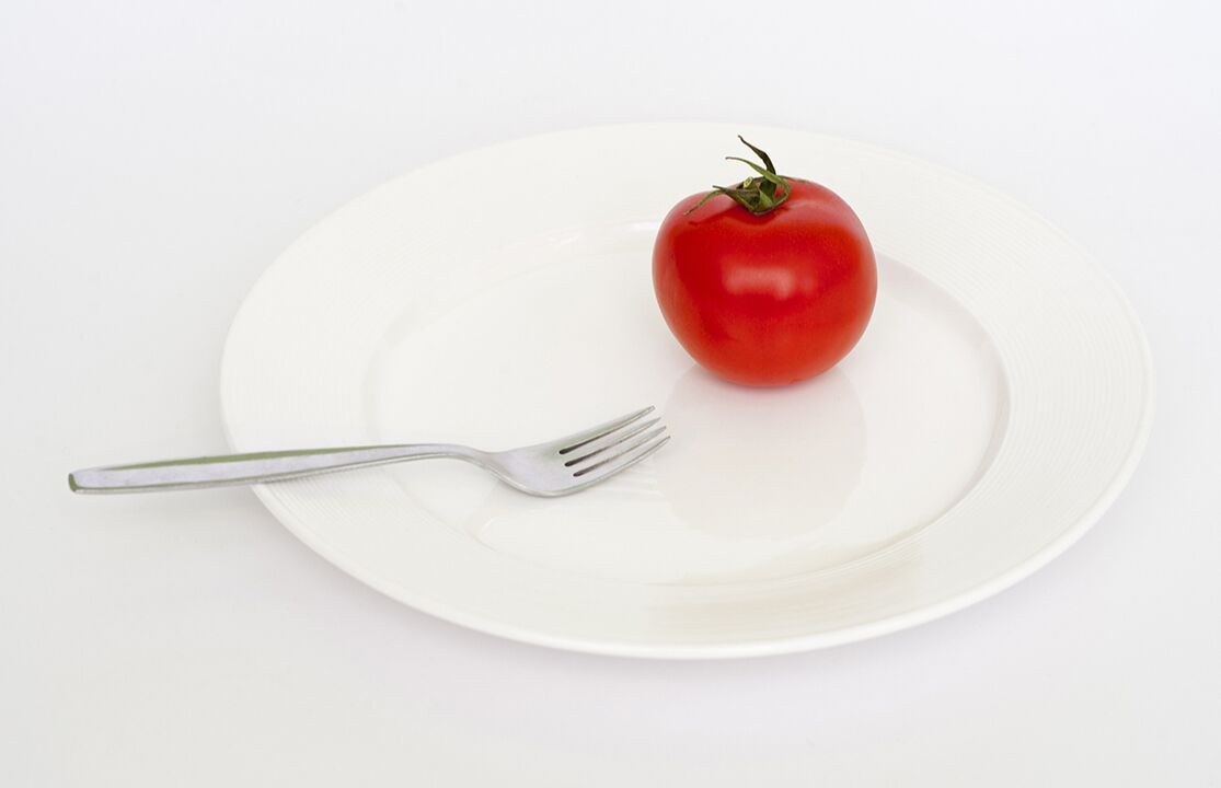 tomato with fork on a plate